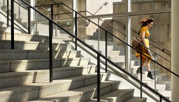 Afternoon sun casts shadows on the steps of the Physical Science Building.