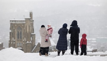 Families enjoy the winter view over Libe Slope.