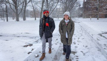 Students walk across the Arts Quad after a snow storm.