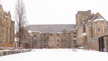 Anabel Taylor Hall courtyard is covered in snow.