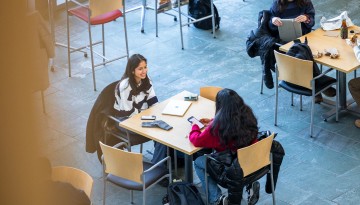 Students grab lunch and work in Duffield Atrium during the first day of class.