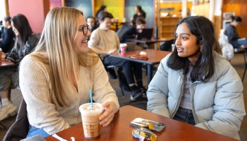 Students meet in Amit Bhatia Libe Cafe in Olin Library.
