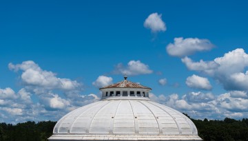 The Sibley Hall dome is seen amongst the clouds.