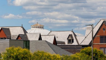 Rooftops of Sibley and Lincoln halls shine in the summer sun.