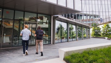 Students walk outside the Tata Innovation Center at Cornell Tech.