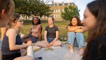 Students enjoy the evening light on The Slope.