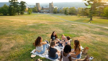 Students enjoy the evening light on The Slope.