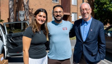 President Kotlikoff poses with a family. 