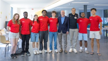 President Kotlikoff poses with staff and volunteers. 
