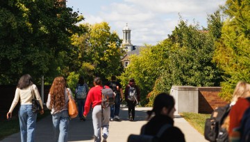 Students walk to their next class across from the ILR School.