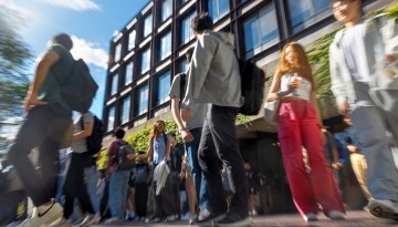 Students leave Uris Hall after class lets out.