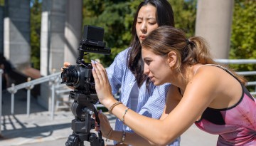 Students in a video production class work on a project outside the Schwartz Center for Performing and Media Arts.