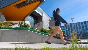 Students pass Gates Hall between morning classes.