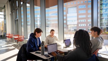 Engineering students work together in the Computing and Information Science Building.