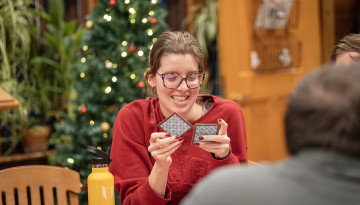 Students play a game in the Big Red Barn.