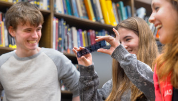 Students from New Visions hold strips of film at the Spacecraft Planetary Image Facility