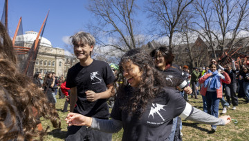 Students running around the dragon. 