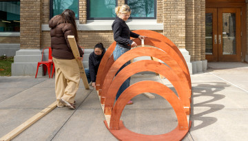 Students work outside of Rand Hall.