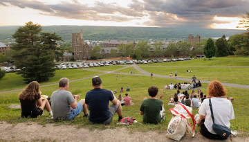 Reunion 2026 attendees sit on the Slope