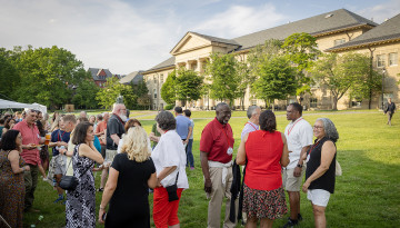 Reunion 2026 attendees socialize outside