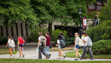Summer students pass Uris Hall.