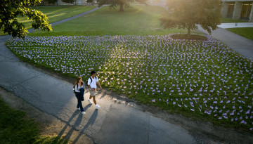 Students walk by a 9/11 display on the Arts Quad.