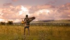 Ethiopian man walking on farmland