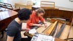 Lee and Zabelina regulate a piano modeled after Johann Schantz (ca. 1800) by Thomas and Barbara Wolf.