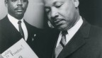 Martin Luther King Jr. reading an 1199 pamphlet for "Salute to Freedom" 