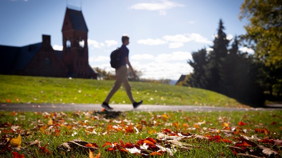 A student walks past Barnes Hall.